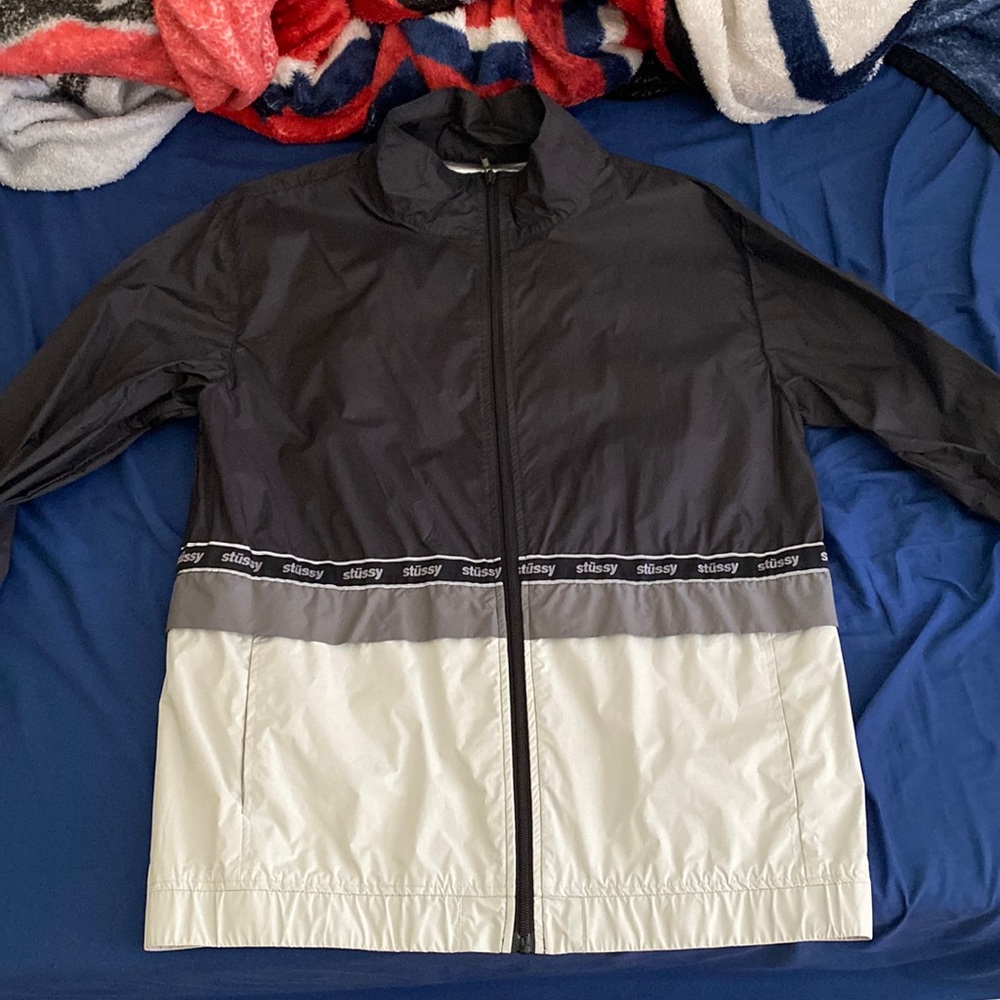 Size medium. Black Stussy Windbreaker.